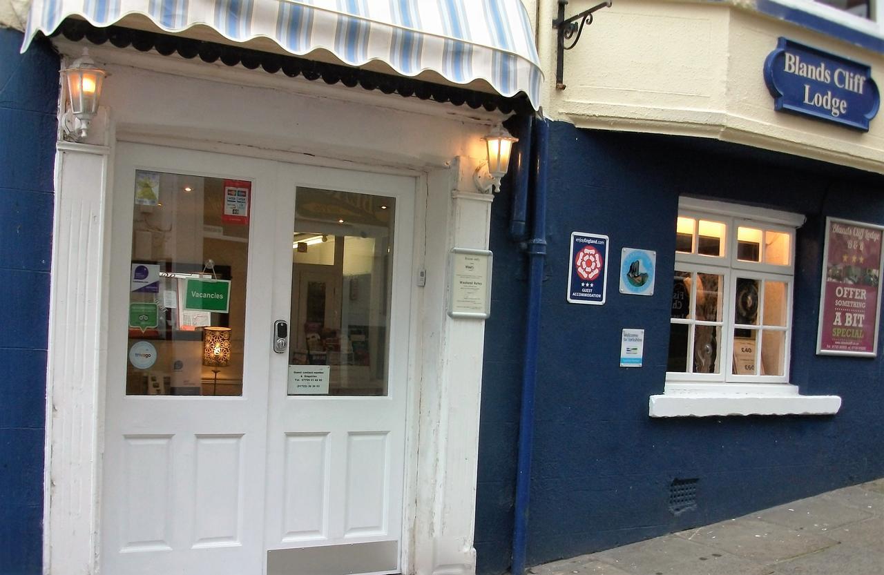 The Lodge entrance with striped awning